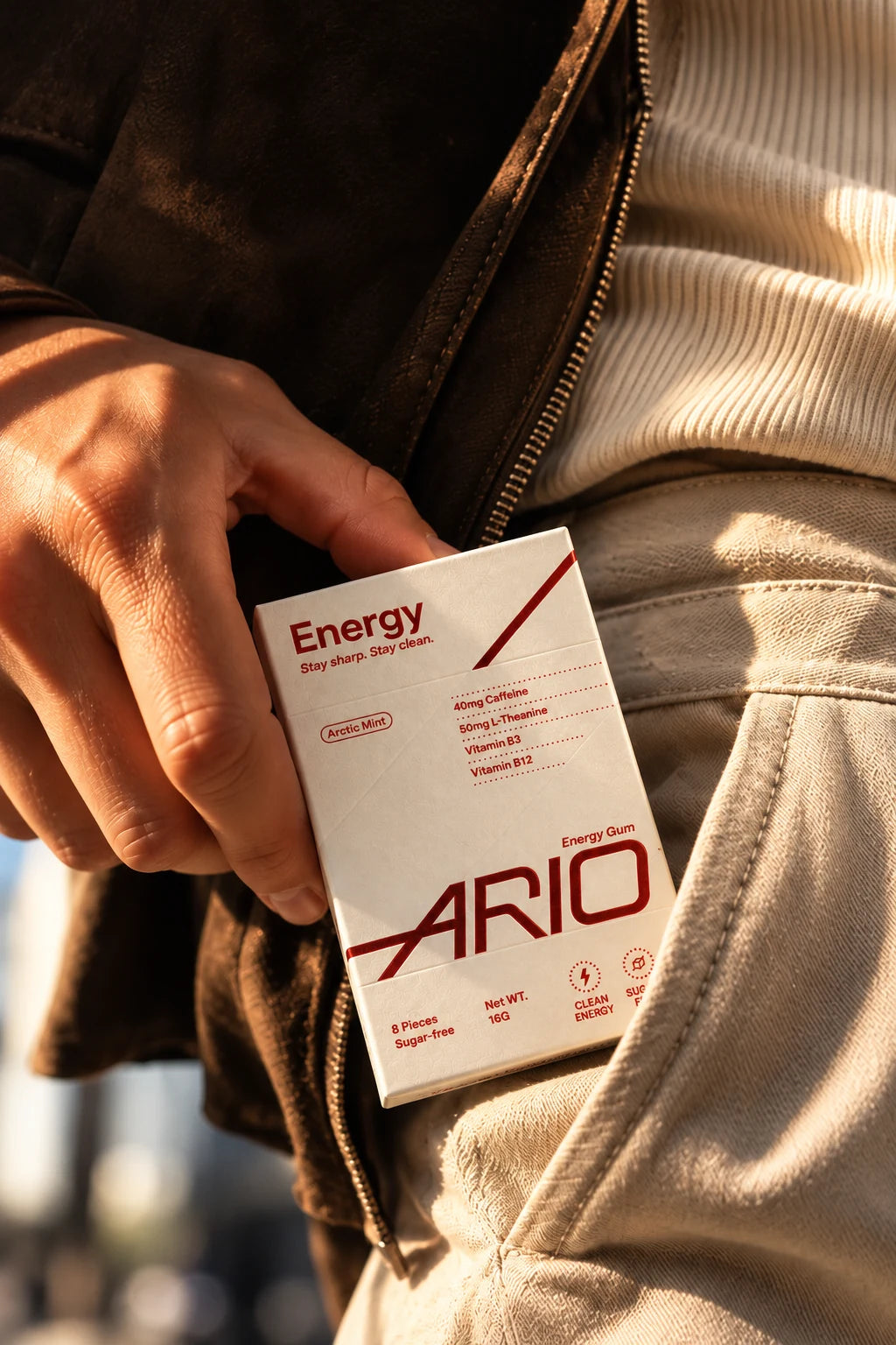 A hand drawing the ARIO pack out of a trouser pocket