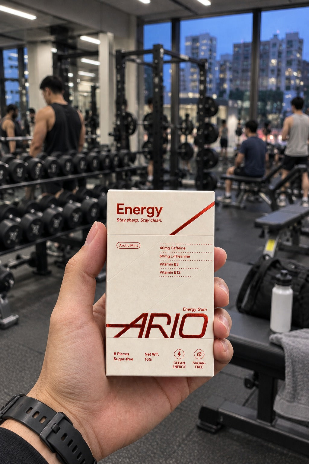 A hand holding the ARIO pack in a Hong Kong gym before a workout